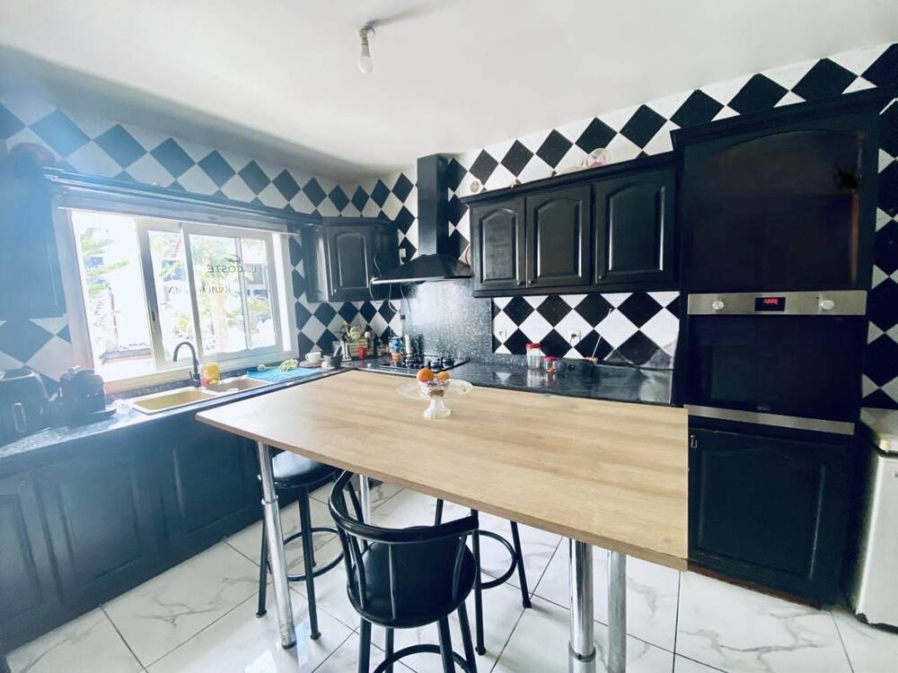 Maison familiale Ligne Paradis de 133 m² habitables à Saint-Pierre avec piscine et jardin aménagé