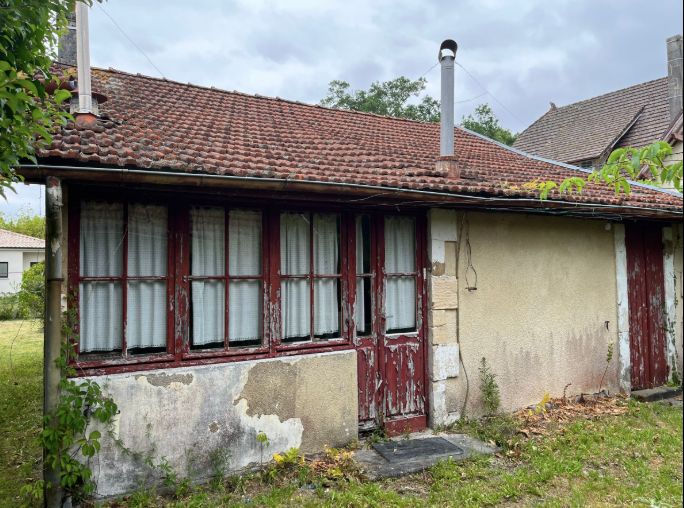 Terrain avec bâti à démolir